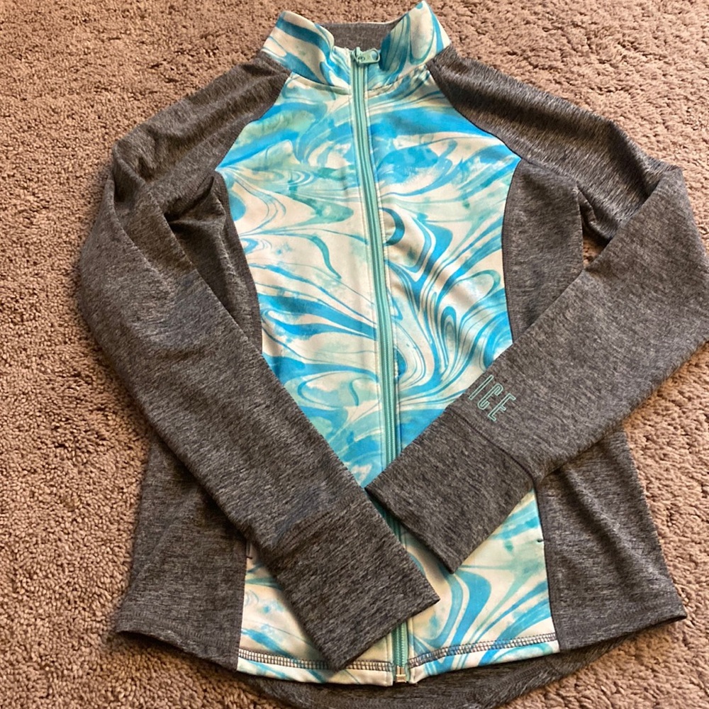 Zip up jacket. Teal, white, and gray. Thumb holes in sleeve.